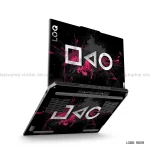 A black laptop skin featuring distressed white gaming symbols (square, triangle, circle) with vibrant pink paint splatters on the lid of an open laptop.